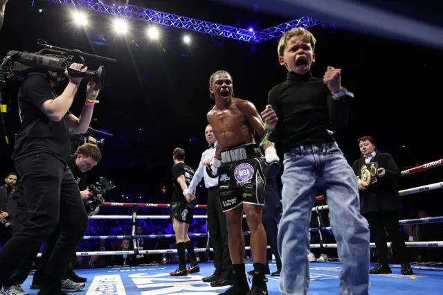 Gerome Warburton celebrates with his son