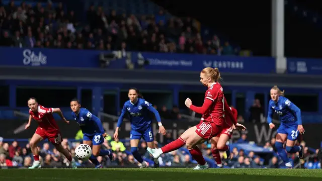 Ceri Holland of Liverpool scores from the penalty spot