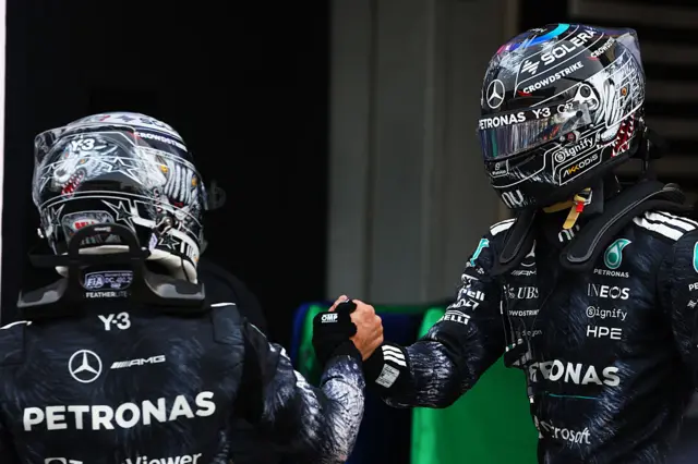 George Russell and Kimi Antonelli shake hands