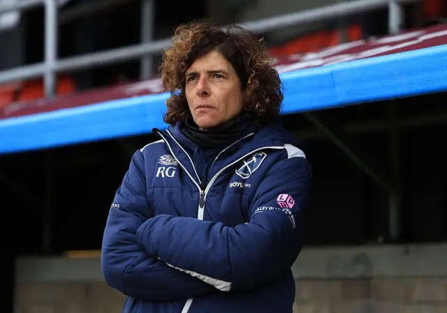 Guarino stands in dugout