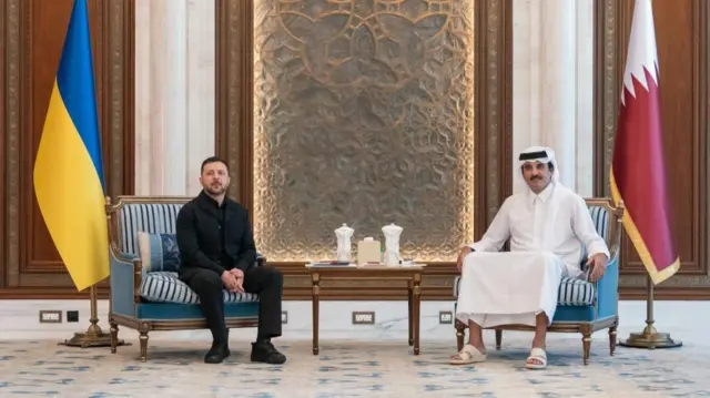 Zelensky sitting on a chair with the Emir of Qatar, Sheikh Tamim bin Hamad Al Thani