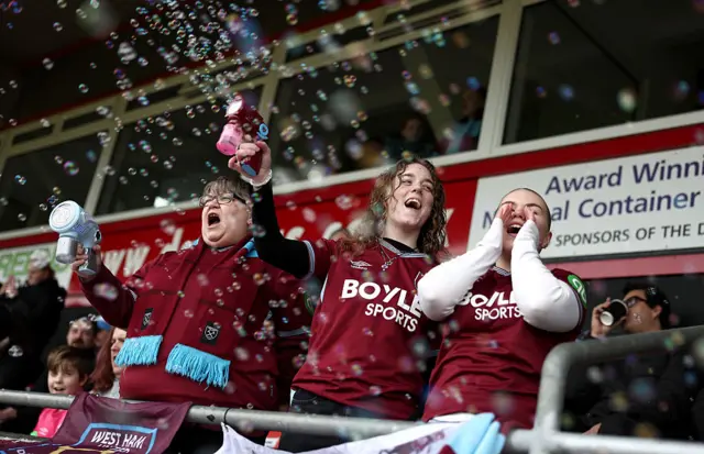 West Ham fans cheer in the stands