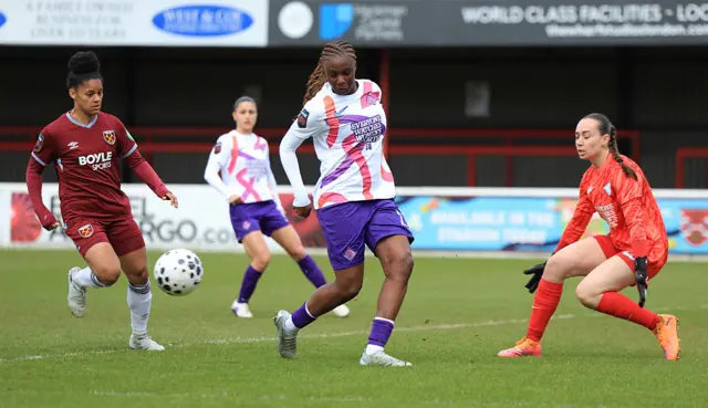 Shekiera Martinez of West Ham United is challenged by Wassa Sangare and Elene Lete of London City Lionesses during the Barclays Women's Super League match between West Ham United and London City Lionesses