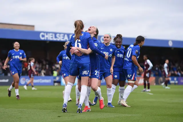 Chelsea players celebrate after scoring their fourth goal
