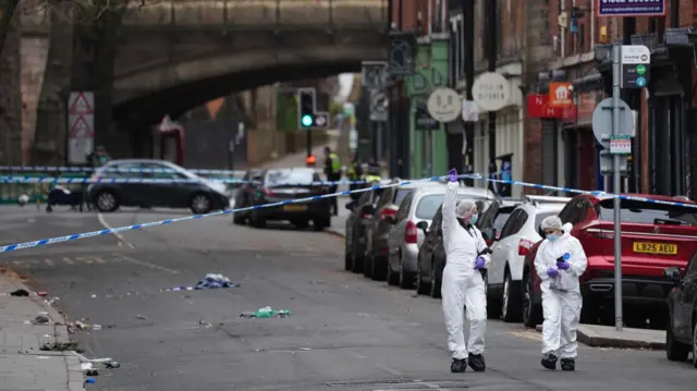 Forensic investigators at the scene in Friar Gate, Derby