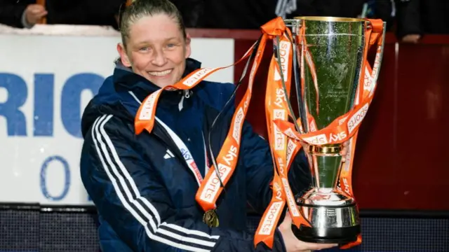 Glasgow City head coach Leanne Ross with the trophy