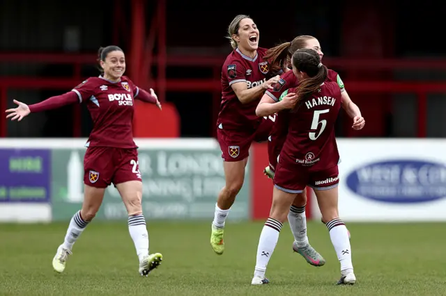 West Ham players celebrate with Oona Siren after her goal