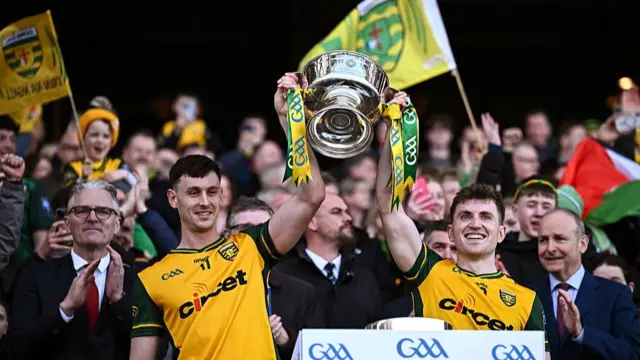 Michael Langan and Shane O'Donnell lift the Mícheál Ó Muircheartaigh Cup