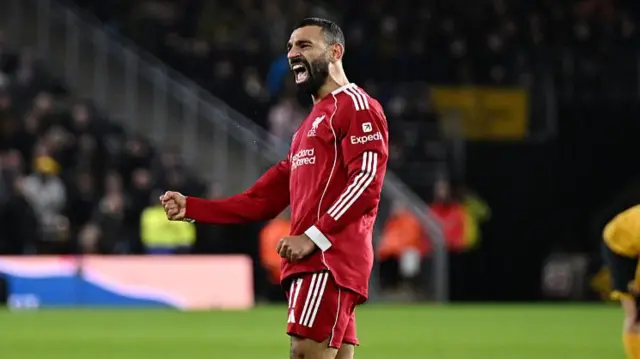 Salah celebrating