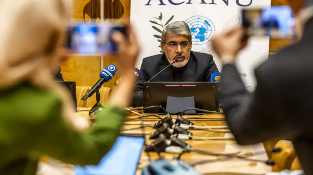 Ali Bahreini, Ambassador and Permanent Representative of the mission of the Islamic Republic of Iran to the United Nations in Geneva, briefs the media following the US and Israeli military strikes on Iran during a press conference organized by the Geneva Association of United Nations Correspondents