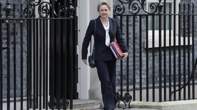 Yvette Cooper leaves 10 Downing Street holding a red folder