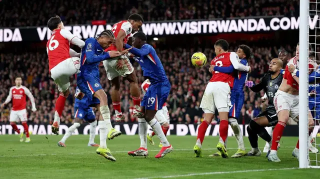 Jurrien Timber of Arsenal scores his team's second goal past Robert Sanchez of Chelsea during the Premier League match between Arsenal and Chelsea