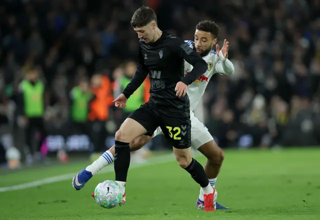 Trai Hume of Sunderland and Jayden Bogle of Leeds United challenge