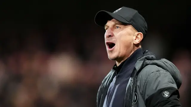 Gerhard Struber stands with his mouth open shouting from the touchline