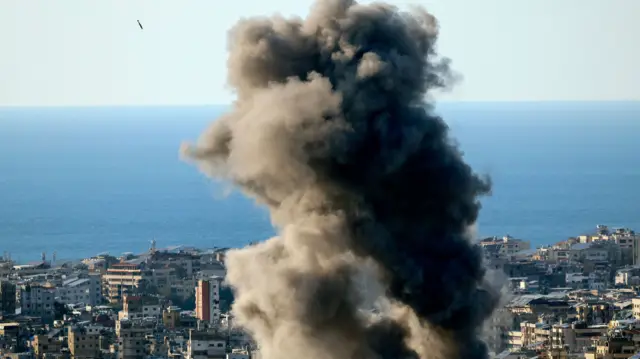 A projectile (L-top) is launched as smoke billows after an Israeli airstrike in Bourj Al Barajneh, in the southern suburbs of Beirut, Lebanon, 02 March 2026.
