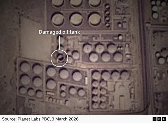 A satellite image, one oil tanker has no roof and burn marks