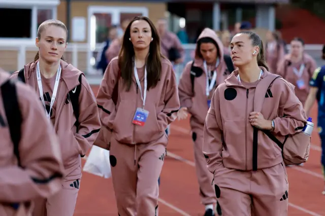 Caroline Weir (centre) arrives with her teammates