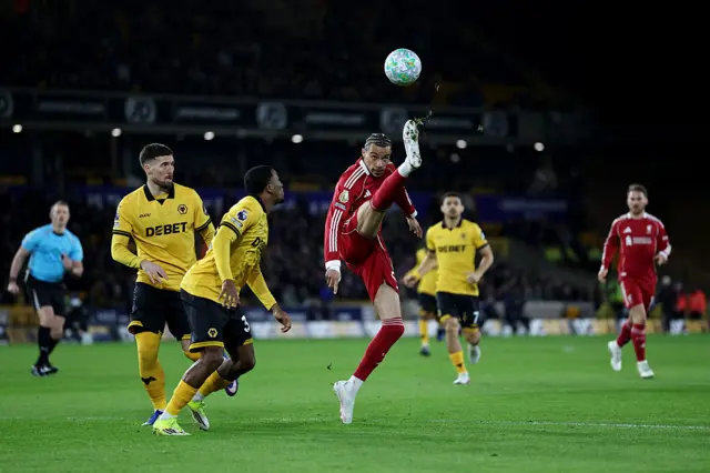 Liverpool's French striker #22 Hugo Ekitike controls the ball whilst under pressure from Wolverhampton Wanderers' Cameroonian defender #38 Jackson Tchatchoua
