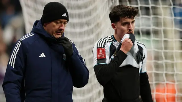 Tino Livramento of Newcastle United reacts as he leaves the pitch following an injury