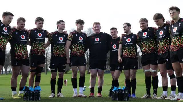 Wales players standing arm-in-arm