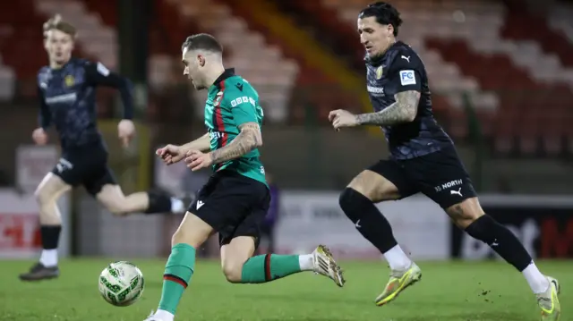 Action from Glentoran v Carrick