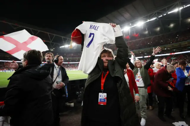 Former England player Lynda Hale and 1972 Squad teammates applaud the fans at half time during the Women's International Friendly match between England and USA at Wembley Stadium on October 07, 2022