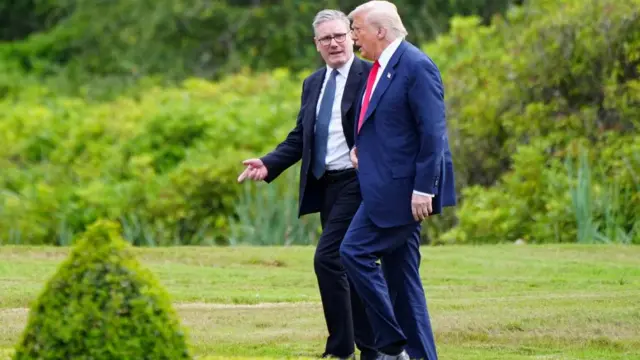 Starmer and Trump walking together at Trump's golf course in Aberdeen