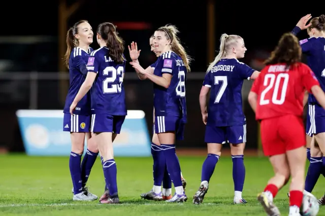 Scotland players celebrate the fourth goal