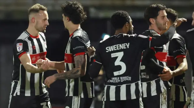 Grimsby Town players celebrate