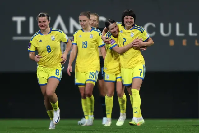 Yana Kalinina of Ukraine celebrates scoring her team's first goal with teammates during the 2027 FIFA Women's World Cup Qualifier between Ukraine and England at Mardan Sports Complex on March 03, 2026 in Antalya, Turkey.