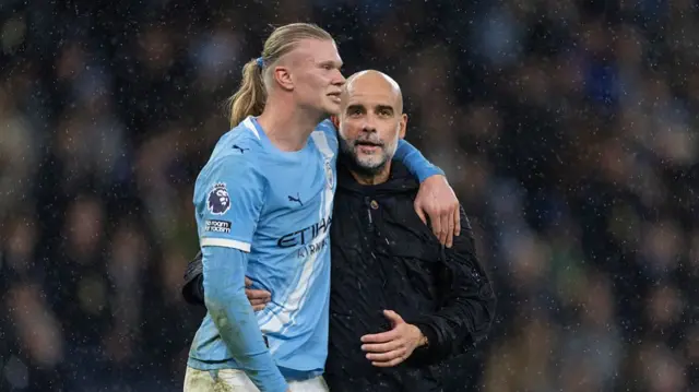 Manchester City manager Pep Guardiola and Erling Haaland