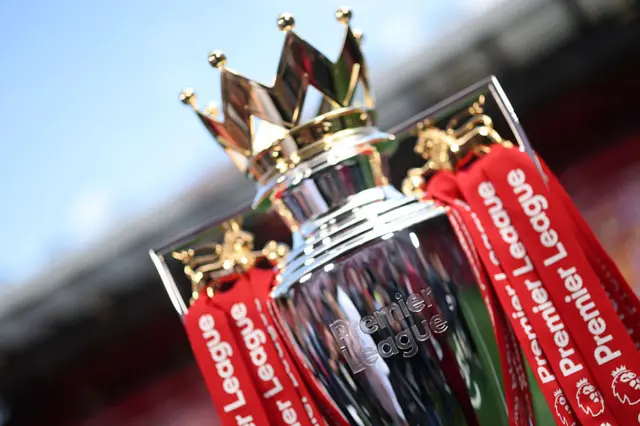 Premier League trophy with red ribbons