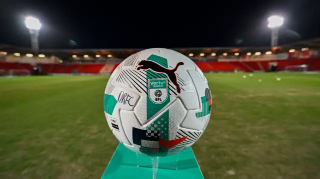 A Verty Trophy Puma football with DRFC written on it on a stand at the side of the pitch before Doncaster v Stockport County's EFL Trophy semi-final