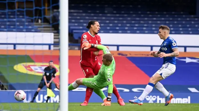 Jordan Pickford tackles Virgil van Dijk