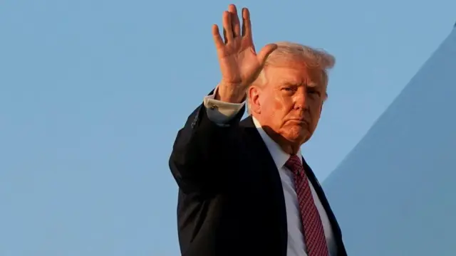 U.S. President Donald Trump waves as he boards Air Force One at Miami International Airport in Miami, Florida, U.S., March 27, 2026.