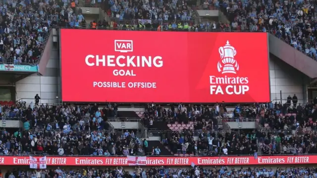 The big screen at Wembley showing VAR checking a possible offside