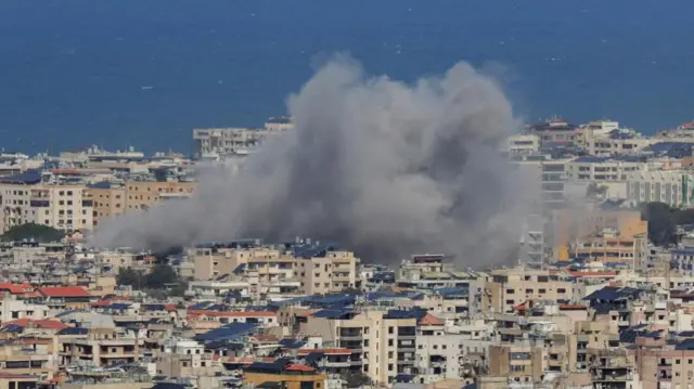 Smoke rises from Beirut's southern suburbs following an Israeli strike on March 30