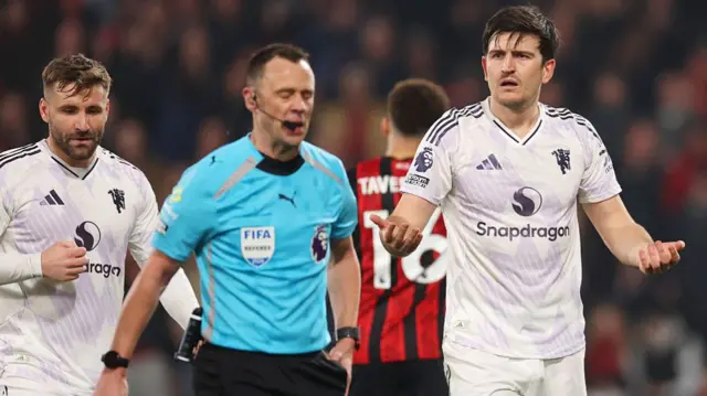 Harry Maguire reacts after being sent off