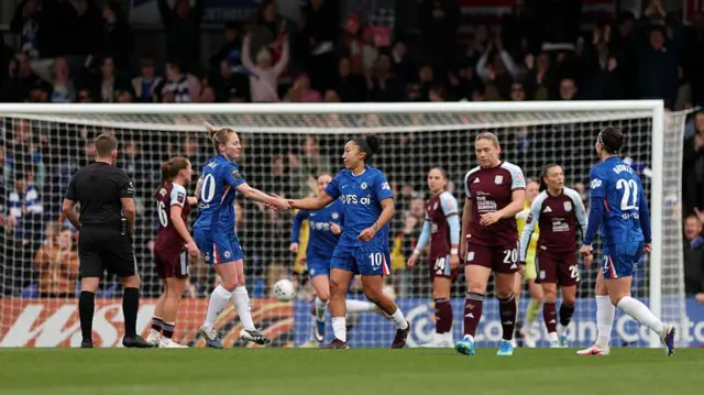 Chelsea players celebrate with Lauren James'