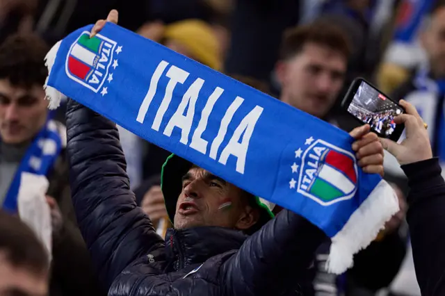 Italy fan holding a scarf