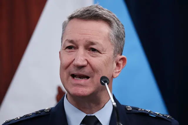 Close-up of Chairman of the Joint Chiefs of Staff Gen. Dan Caine speaking into a microphone