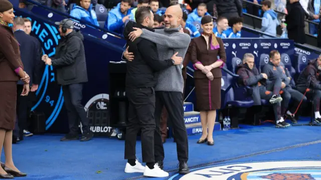 Pep Guardiola hugging Roberto de Zerbi