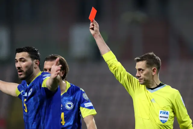 A red card is shown