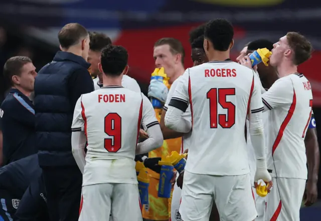England's Cole Palmer, Phil Foden and Morgan Rogers during a break in play