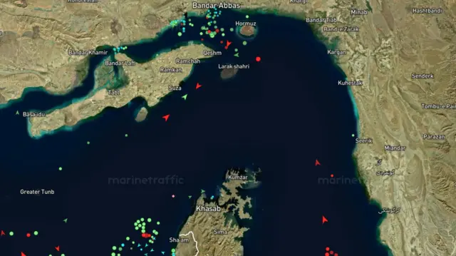 A screengrab showing MarineTraffic's tracking of three vessels in the strair and at least two in the Gulf of Oman heading north