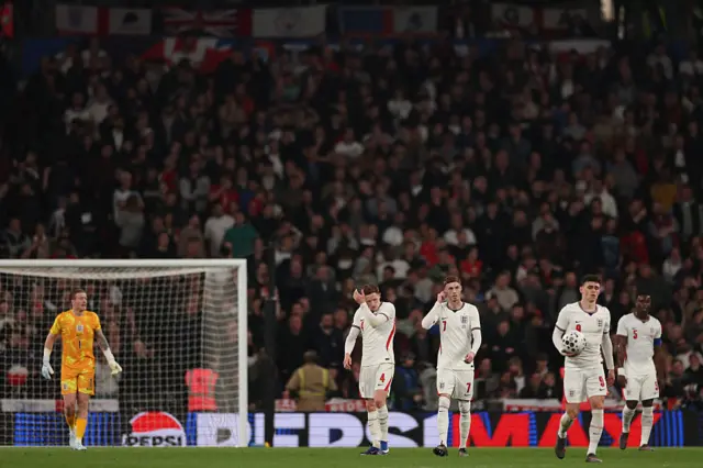 England players react after conceding the opening goal