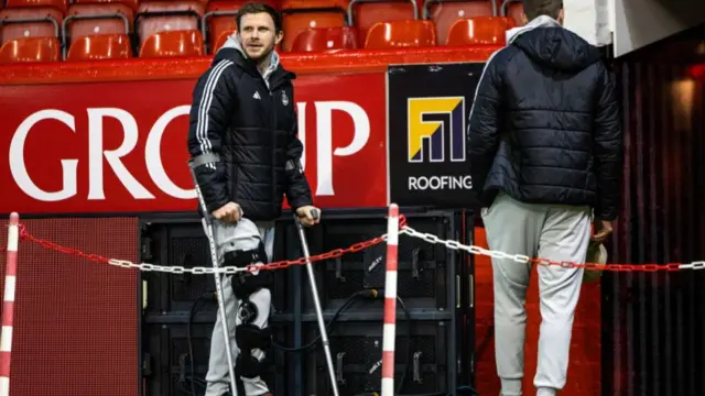 Aberdeen's Nicky Devlin in crutches