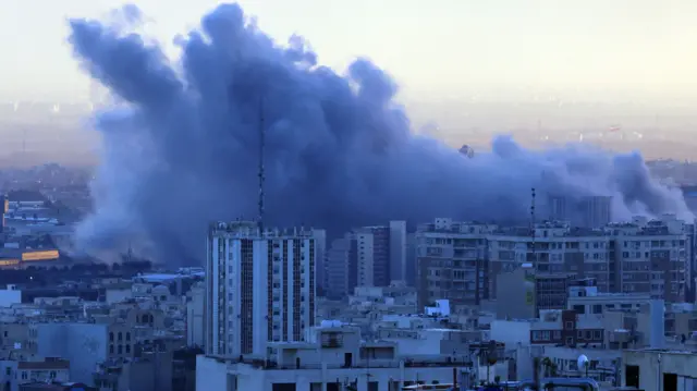 Smoke rises after an airstrike in central Tehran, Iran, 03 March 2026