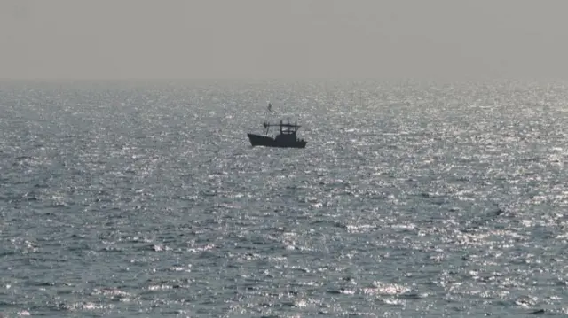 A vessel sails off the Galle coast in Sri Lanka earlier, close to where the Iranian ship went down