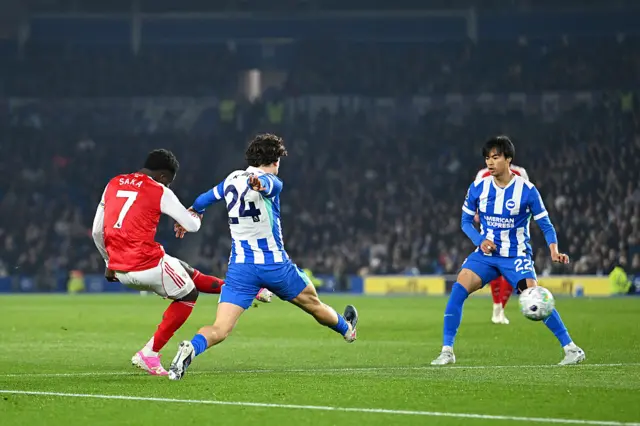 Bukayo Saka of Arsenal scores his team's first goal